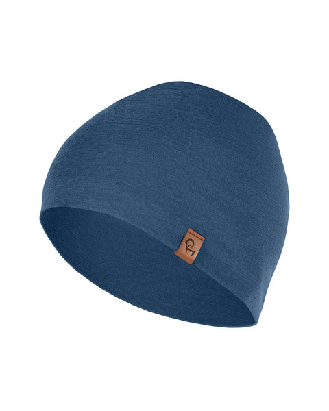 Gorro de lana merina azul extendido sobre un fondo blanco: gorro de invierno ligero, transpirable y suave para niños y adolescentes.