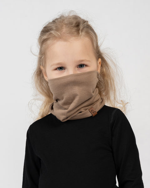 Kids merino wool neck gaiter in beige, soft breathable face covering for warmth and protection.