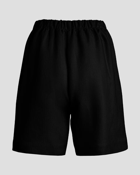 Imagen del reverso de unos pantalones cortos de lino de talle alto.