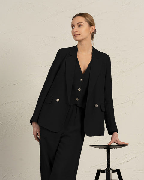 Classic black linen blazer Quin with notch lapels and flap pockets, styled elegantly by menique