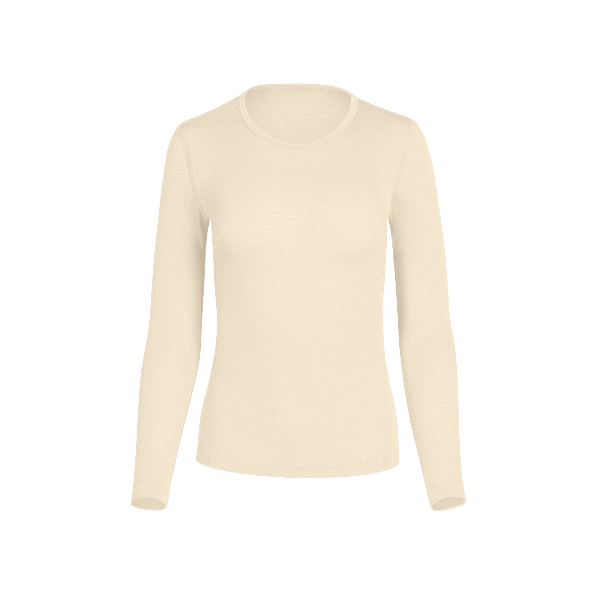 Camiseta base natural de manga larga de lana merina mostrada sobre un fondo blanco, con un cuello redondo clásico, tejido térmico ligero y una silueta estilizada ideal para usar en capas en climas fríos y durante todo el año.