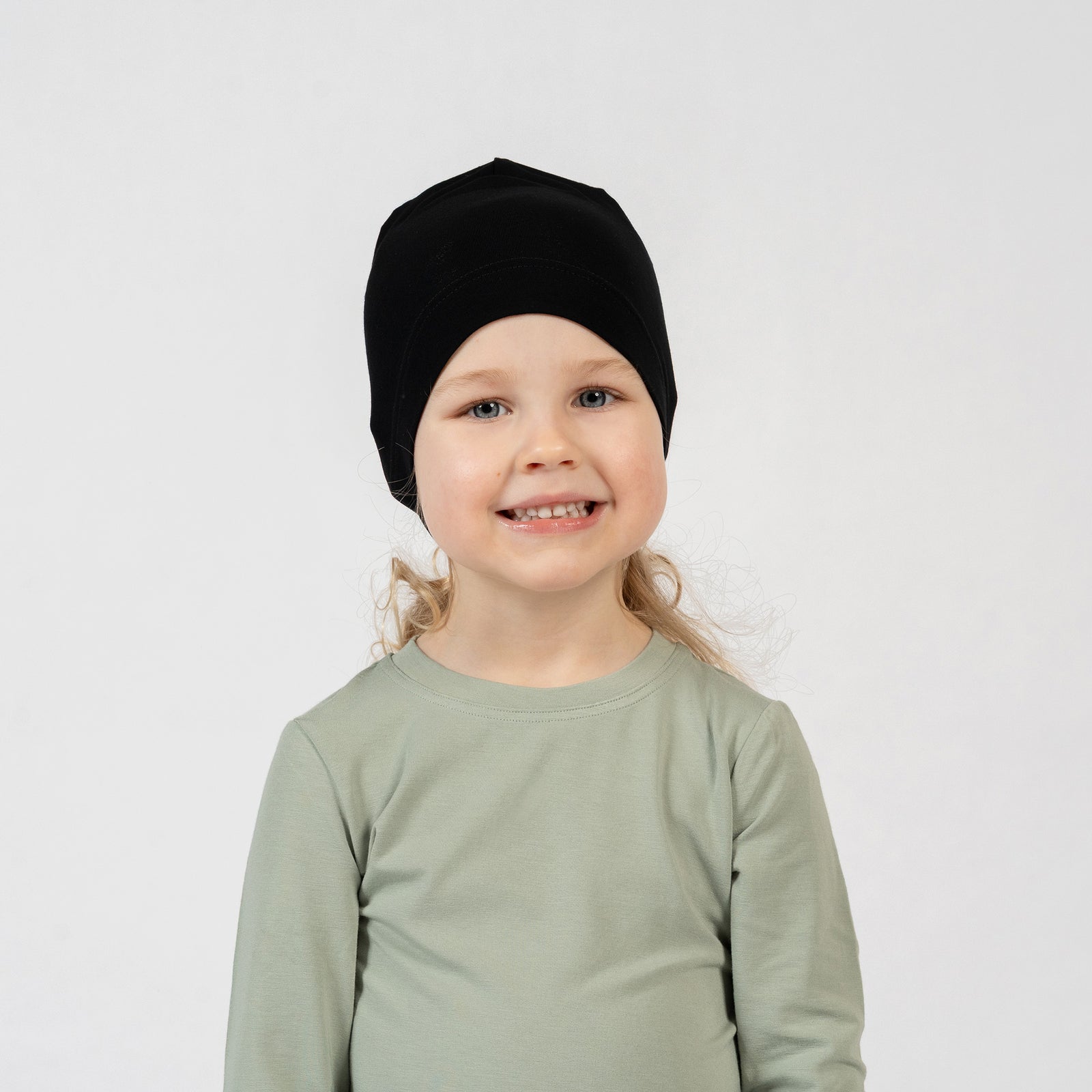 Kids bamboo beanie in blush pink, breathable and comfortable everyday headwear.