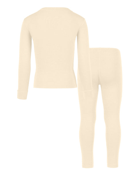 Vista trasera del conjunto infantil menique merino 250 g/m² de dos piezas, con camiseta de manga larga y pantalones, en color natural, fondo blanco.