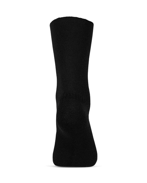 Los calcetines sherpa forrados de merino para hombre de menique en color negro, sobre un fondo blanco, vista del talón.