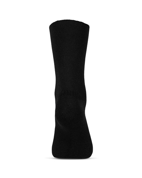 Los calcetines sherpa forrados de merino para mujer de menique en color negro, sobre fondo blanco, vista del talón.